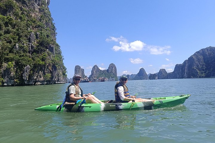 A scenic day tour of Halong Bay, Vietnam, featuring limestone karsts, emerald waters, and traditional boats, photo 19 | wizardtrip