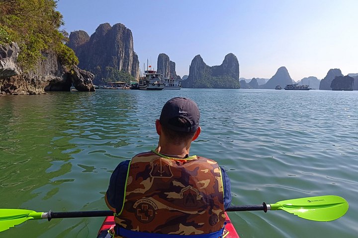 A scenic day tour of Halong Bay, Vietnam, featuring limestone karsts, emerald waters, and traditional boats, photo 20 | wizardtrip
