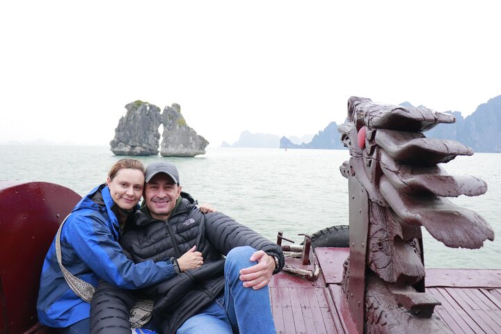 A scenic day tour of Halong Bay, Vietnam, featuring limestone karsts, emerald waters, and traditional boats, photo 28 | wizardtrip