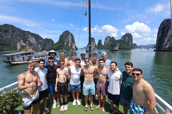 A scenic day tour of Halong Bay, Vietnam, featuring limestone karsts, emerald waters, and traditional boats, photo 33 | wizardtrip
