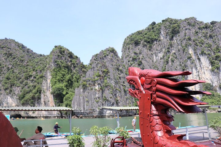 A scenic day tour of Halong Bay, Vietnam, featuring limestone karsts, emerald waters, and traditional boats, photo 36 | wizardtrip