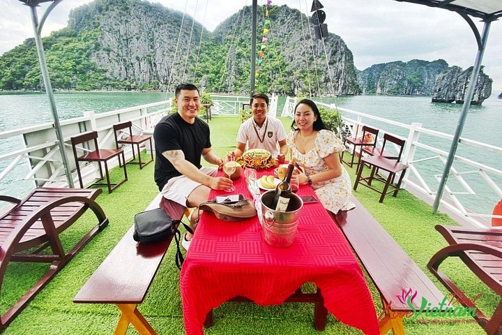 A scenic day tour of Halong Bay, Vietnam, featuring limestone karsts, emerald waters, and traditional boats, photo 45 | wizardtrip