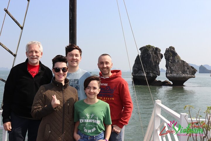 A scenic day tour of Halong Bay, Vietnam, featuring limestone karsts, emerald waters, and traditional boats, photo 47 | wizardtrip