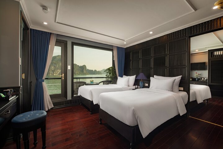 Luxury cruise navigating through the stunning limestone karsts of Ha Long Bay, Vietnam, photo 14 | wizardtrip