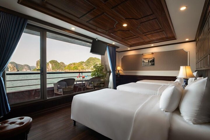 Luxury cruise navigating through the stunning limestone karsts of Ha Long Bay, Vietnam, photo 16 | wizardtrip