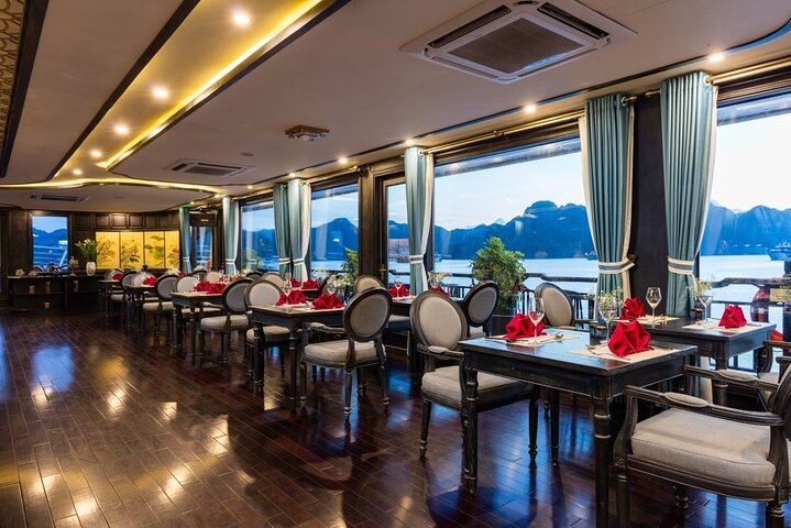Luxury cruise navigating through the stunning limestone karsts of Ha Long Bay, Vietnam, photo 26 | wizardtrip