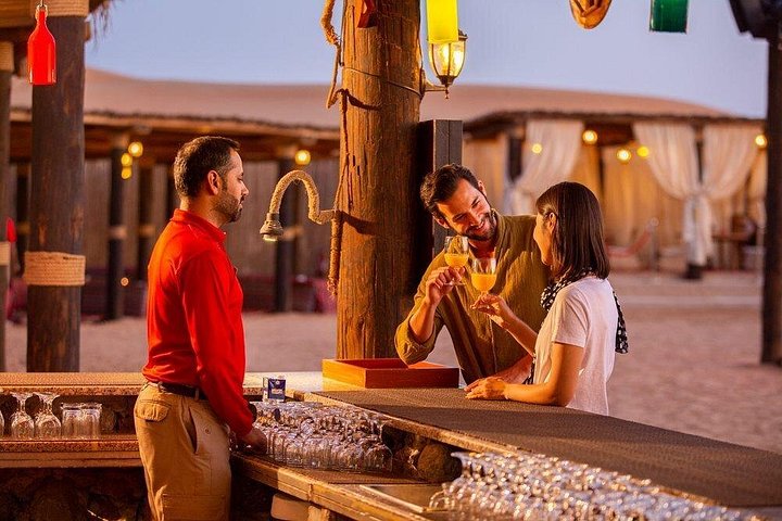 Experience a thrilling Dubai desert safari with dune bashing, camel rides, sandboarding, and a BBQ dinner, photo 8 | wizardtrip