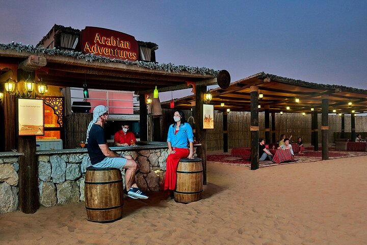 Experience a thrilling Dubai desert safari with dune bashing, camel rides, sandboarding, and a BBQ dinner, photo 11 | wizardtrip