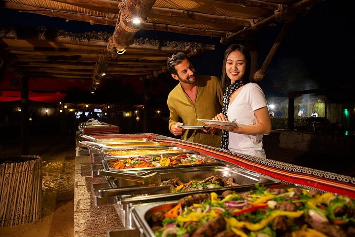 Experience a thrilling Dubai desert safari with dune bashing, camel rides, sandboarding, and a BBQ dinner, photo 12 | wizardtrip