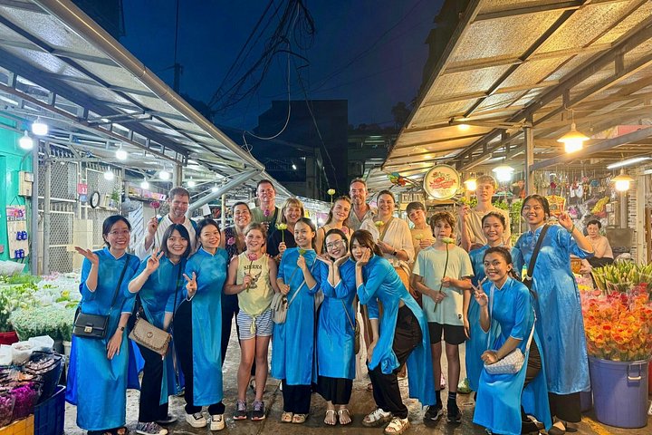 Experience Ho Chi Minh City's vibrant nightlife on a motorbike tour with a female guide, tasting local snacks and seeing city lights, photo 11 | wizardtrip
