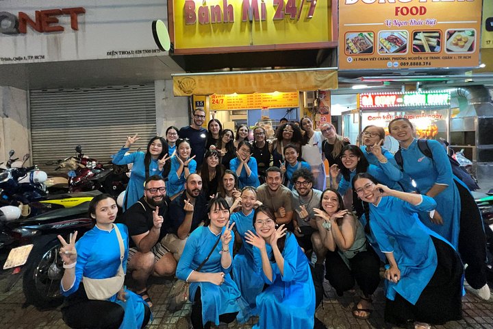 Experience Ho Chi Minh City's vibrant nightlife on a motorbike tour with a female guide, tasting local snacks and seeing city lights, photo 16 | wizardtrip