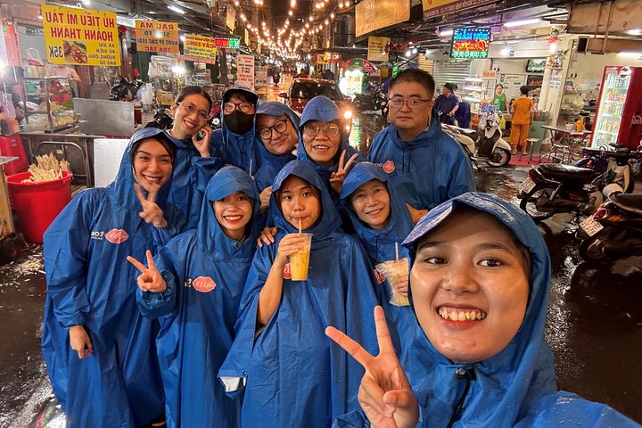 Experience Ho Chi Minh City's vibrant nightlife on a motorbike tour with a female guide, tasting local snacks and seeing city lights, photo 23 | wizardtrip