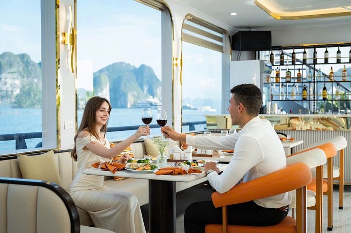 A scenic day cruise through Ha Long Bay, Vietnam, featuring caves, islands, and onboard activities, photo 6 | wizardtrip