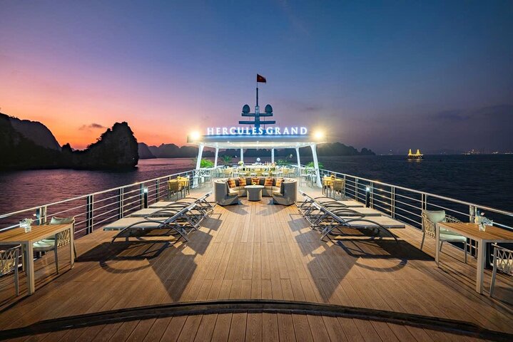 A scenic day cruise through Ha Long Bay, Vietnam, featuring caves, islands, and onboard activities, photo 7 | wizardtrip