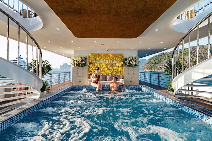 A scenic day cruise through Ha Long Bay, Vietnam, featuring caves, islands, and onboard activities, photo 8 | wizardtrip