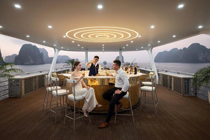 A scenic day cruise through Ha Long Bay, Vietnam, featuring caves, islands, and onboard activities, photo 9 | wizardtrip