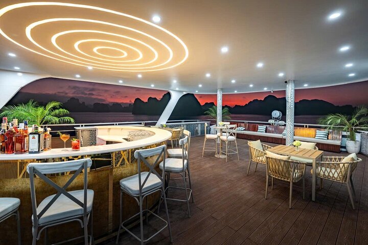 A scenic day cruise through Ha Long Bay, Vietnam, featuring caves, islands, and onboard activities, photo 12 | wizardtrip