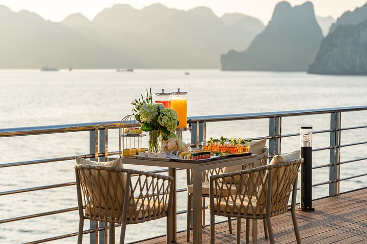 A scenic day cruise through Ha Long Bay, Vietnam, featuring caves, islands, and onboard activities, photo 13 | wizardtrip