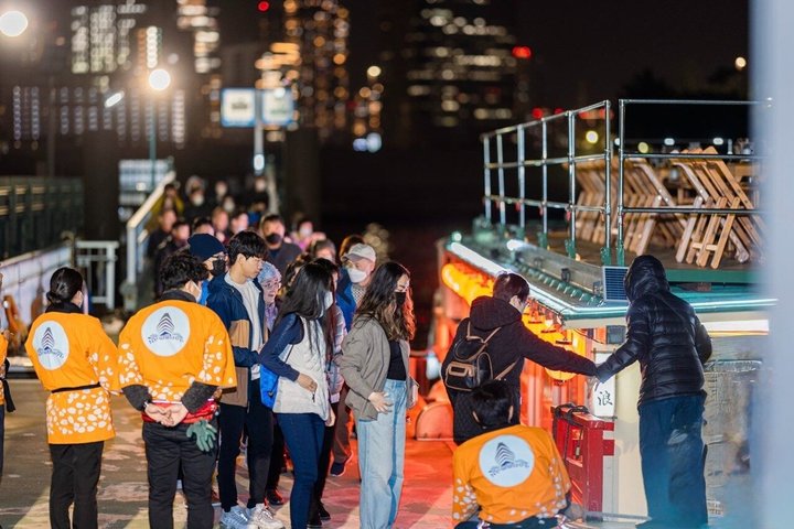 Traditional Japanese Yakatabune houseboat cruise in Tokyo Bay with city skyline views, photo 11 | wizardtrip
