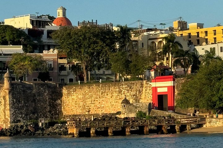 Sunset boat tour in San Juan Bay, Puerto Rico, with views of historic landmarks, photo 10 | wizardtrip