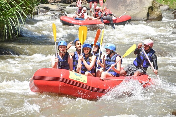 Exciting white water rafting adventure on the Ayung River in Ubud, Bali, surrounded by lush tropical scenery, photo 9 | wizardtrip