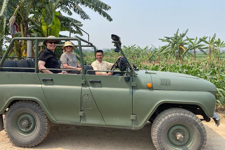 Vintage Jeep tour exploring Hanoi's highlights, including Train Street, local life, and scenic lakes, photo 6 | wizardtrip