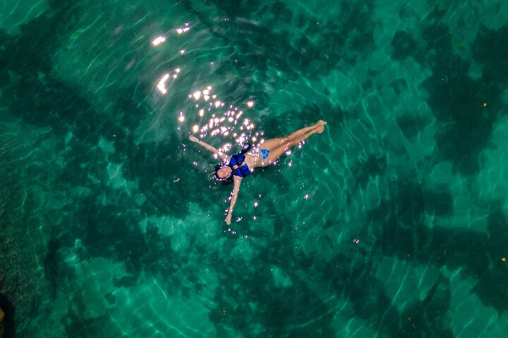 Explore Tulum's Mayan ruins, swim in cenotes, snorkel in Yal-kú lagoon, and enjoy lunch by the beach, photo 6 | wizardtrip