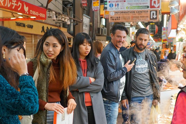 Un tour gastronómico guiado que explora el vibrante Mercado Kuromon y el distrito de Dotonbori en Osaka, con delicias locales, foto 24 | wizardtrip