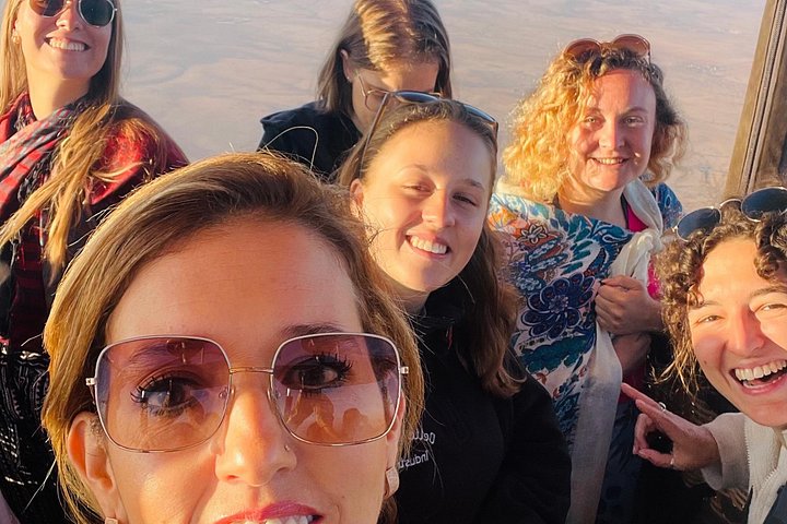 Hot air balloon floating over Marrakech at sunrise with Atlas Mountains view, photo 16 | wizardtrip