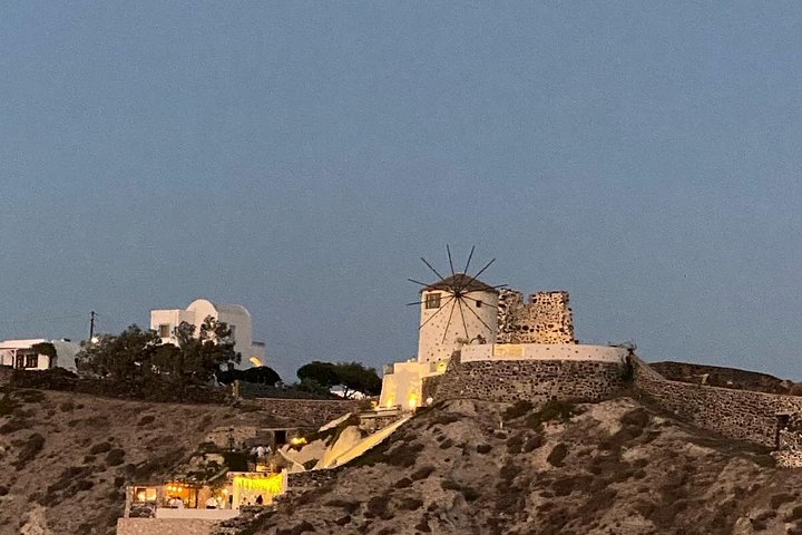 Santorini shore excursion featuring blue-domed churches, Oia village, and black sand beaches, photo 7 | wizardtrip