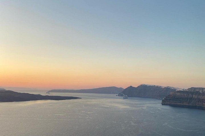 Santorini shore excursion featuring blue-domed churches, Oia village, and black sand beaches, photo 9 | wizardtrip