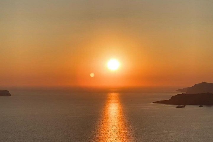 Santorini shore excursion featuring blue-domed churches, Oia village, and black sand beaches, photo 15 | wizardtrip