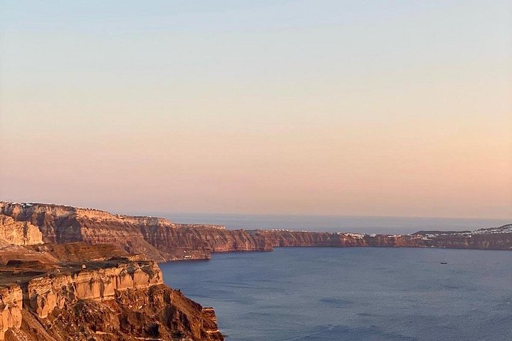 Santorini shore excursion featuring blue-domed churches, Oia village, and black sand beaches, photo 16 | wizardtrip