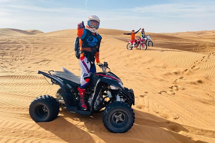 Experience a thrilling Dubai desert safari with quad biking, sandboarding, camel rides, and a BBQ dinner, photo 6 | wizardtrip