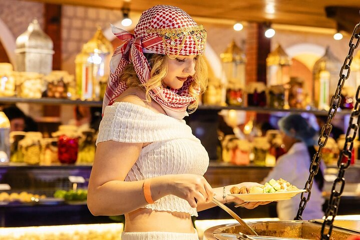 Experience a thrilling Dubai desert safari with quad biking, sandboarding, camel rides, and a BBQ dinner, photo 11 | wizardtrip