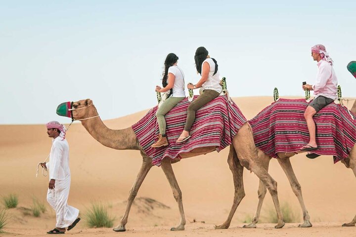 Experience a thrilling Dubai desert safari with quad biking, sandboarding, camel rides, and a BBQ dinner, photo 12 | wizardtrip