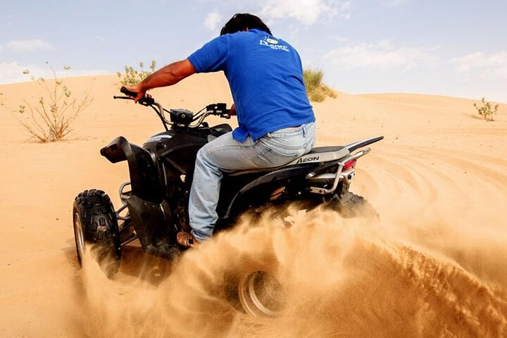 Experience a thrilling Dubai desert safari with quad biking, sandboarding, camel rides, and a BBQ dinner, photo 13 | wizardtrip