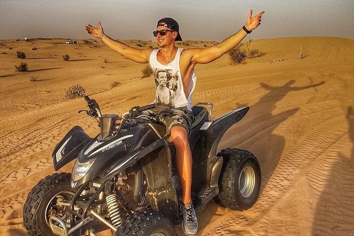 Experience a thrilling Dubai desert safari with quad biking, sandboarding, camel rides, and a BBQ dinner, photo 14 | wizardtrip