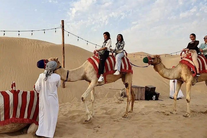 Experience a thrilling Dubai desert safari with quad biking, sandboarding, camel rides, and a BBQ dinner, photo 22 | wizardtrip