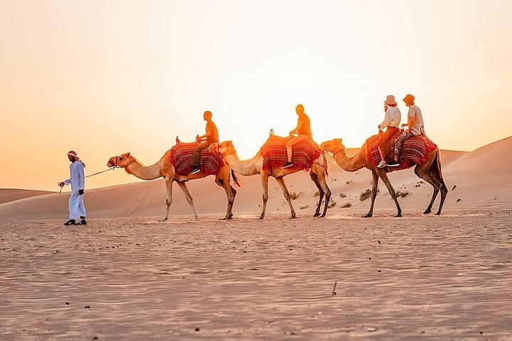 Experience a thrilling Dubai desert safari with quad biking, sandboarding, camel rides, and a BBQ dinner, photo 23 | wizardtrip