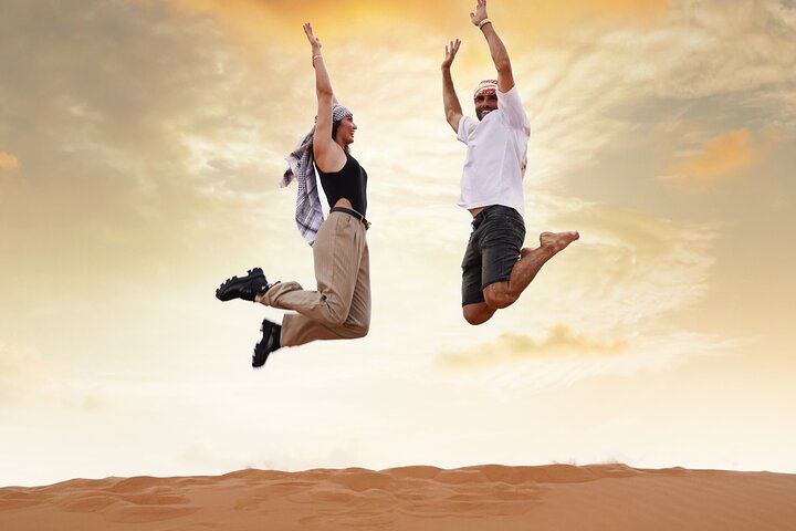 Experience a thrilling Dubai desert safari with dune bashing, sandboarding, camel rides, and optional BBQ dinner, photo 6 | wizardtrip