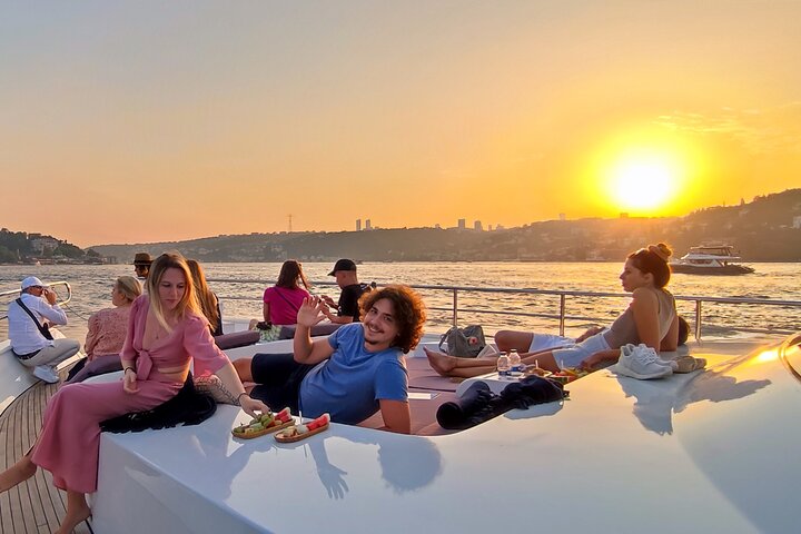 Luxury yacht cruise on Istanbul's Bosphorus at sunset, offering city views and refreshments, photo 13 | wizardtrip