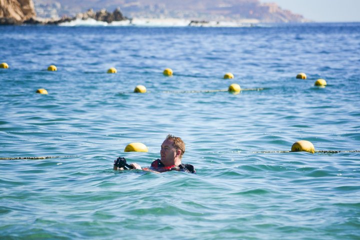 Snorkelers exploring vibrant coral reefs and diverse marine life in the clear waters of Cabo San Lucas, photo 12 | wizardtrip