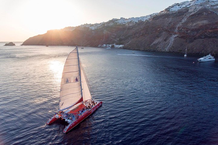 Catamaran sailing cruise in Santorini, Greece, exploring the caldera, hot springs, and beaches with BBQ, photo 6 | wizardtrip