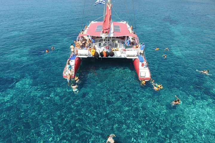 Catamaran sailing cruise in Santorini, Greece, exploring the caldera, hot springs, and beaches with BBQ, photo 7 | wizardtrip