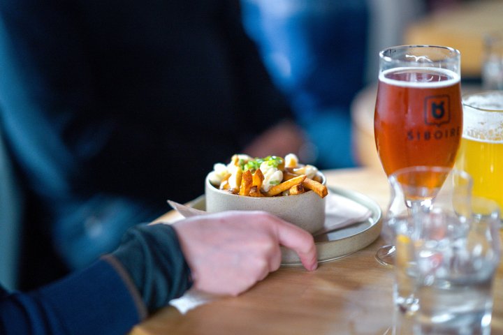 Montreal Mile End food tour tasting bagels, poutine, and smoked meat, photo 17 | wizardtrip