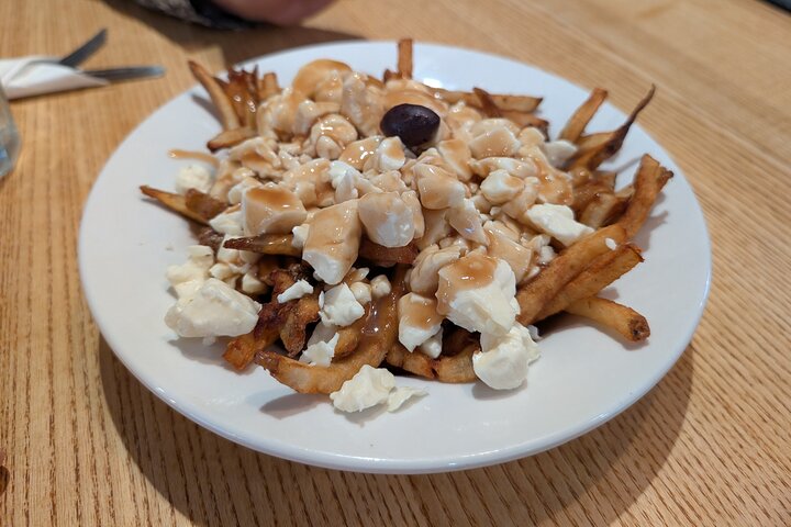 Montreal Mile End food tour tasting bagels, poutine, and smoked meat, photo 19 | wizardtrip