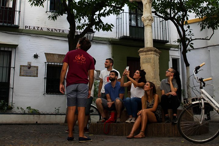 Guided bike tour exploring Seville's historic landmarks and charming neighborhoods, photo 9 | wizardtrip
