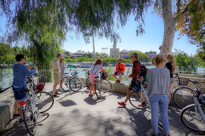 Guided bike tour exploring Seville's historic landmarks and charming neighborhoods, photo 13 | wizardtrip