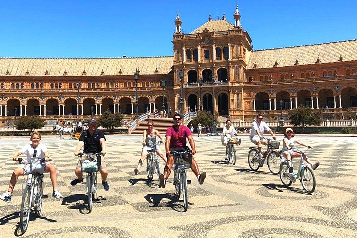 Guided bike tour exploring Seville's historic landmarks and charming neighborhoods, photo 15 | wizardtrip